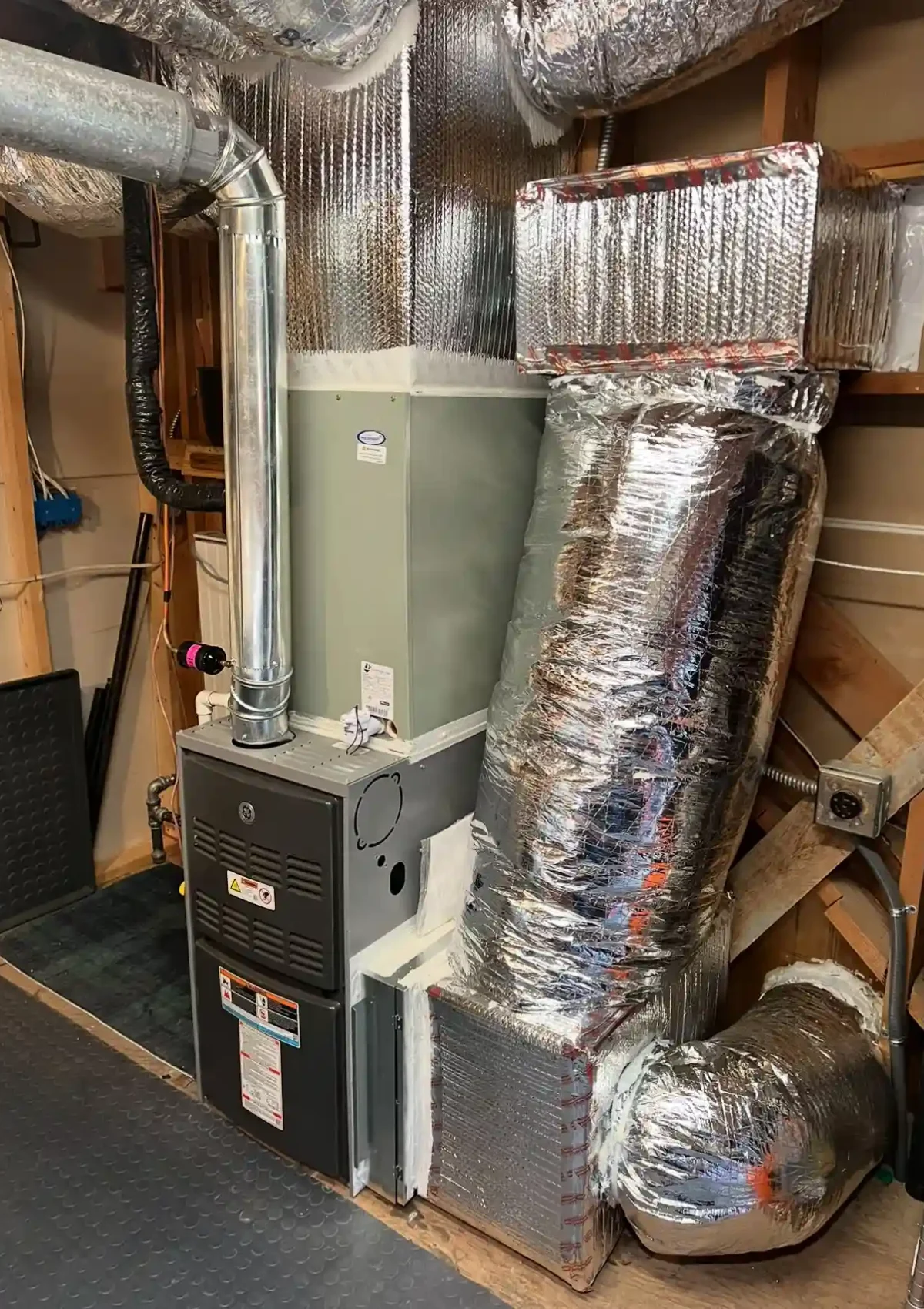 Complex heating system installation, with sealed ductwork.