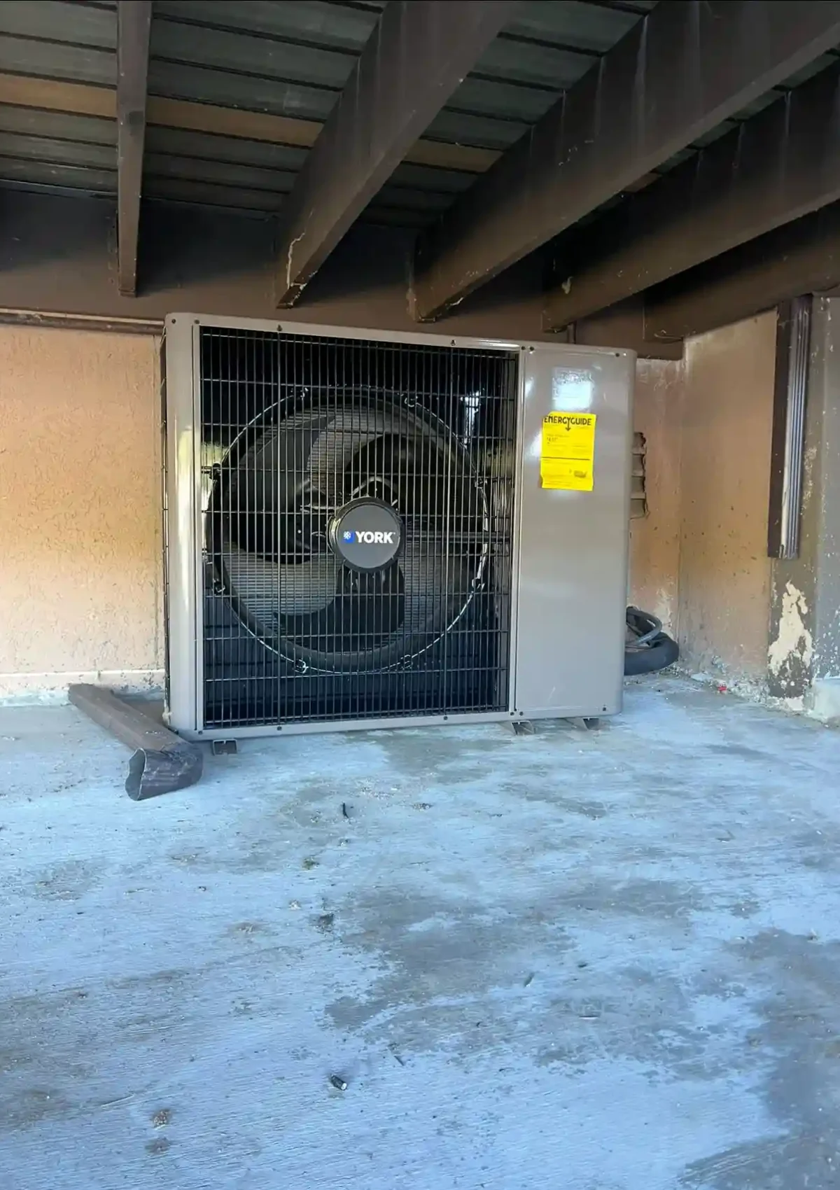 Ductless air conditioning system under a house.