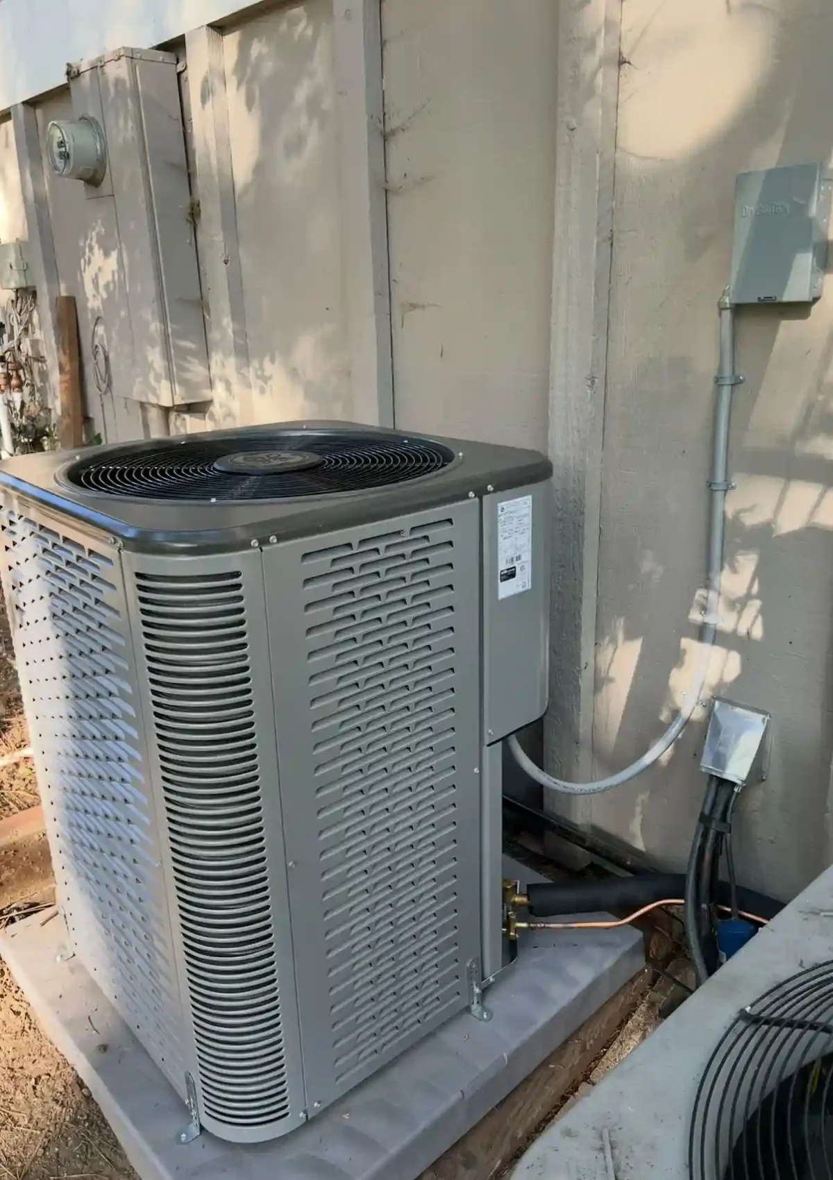 Outdoor air conditioning system connected to a home.